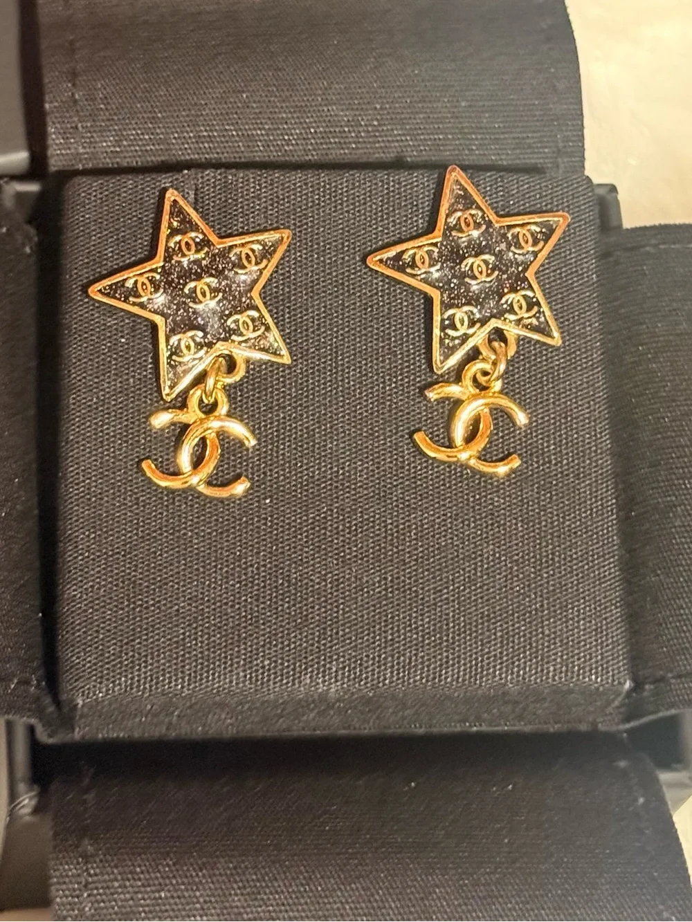 CHANEL Gold Star Drop Earrings with Black Enamel